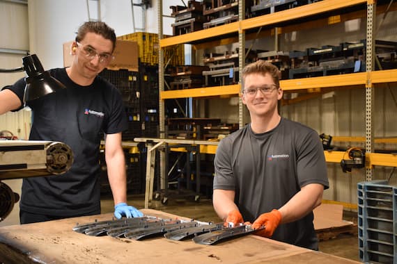 Two employees at work table