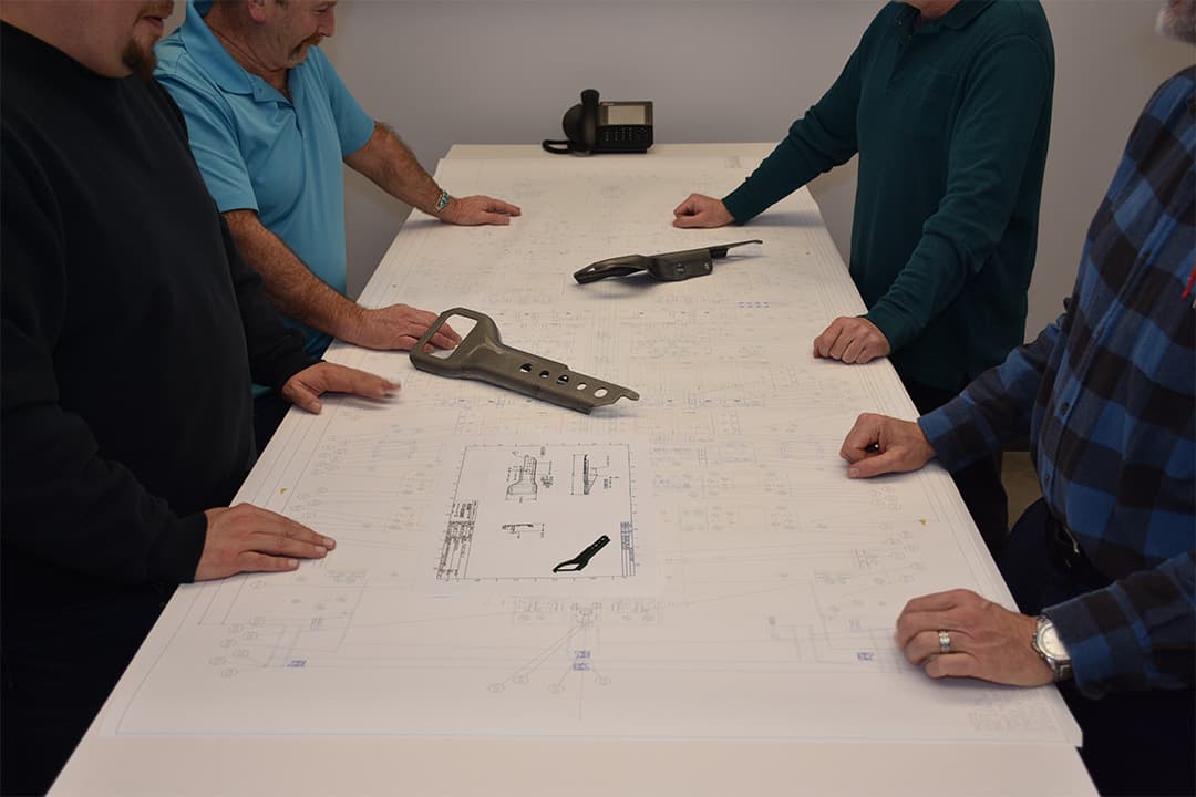 engineers reviewing prototype